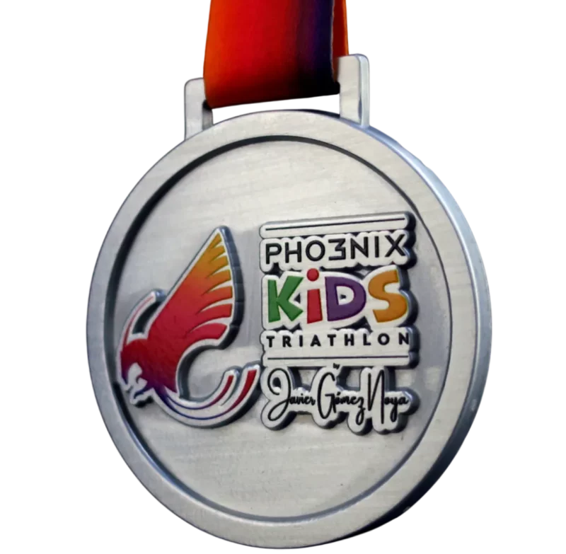 Circular medal for the Pho3nix Kids Triathlon with a vibrant logo and colourful design.