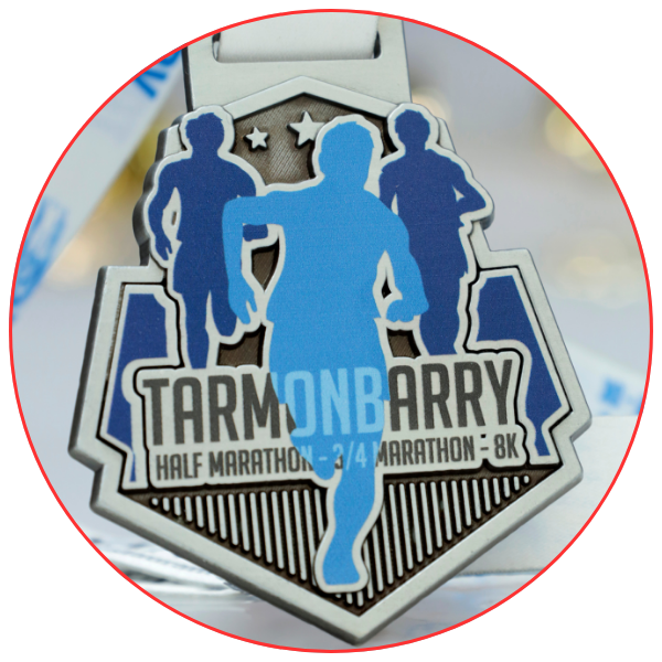 Custom medal for the Tarmonbarry Half Marathon, featuring runners in blue and grey tones.