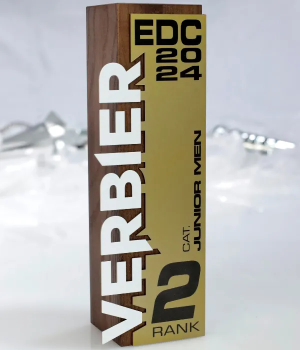 A wooden and metal award engraved with 'Verbier 2024', marking second place for Junior Men.