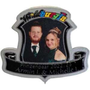 A carnival badge featuring a couple's portrait and the text 'Prinzenpaar 2022/23 Armin I. & Michelle I.' with a colourful logo.