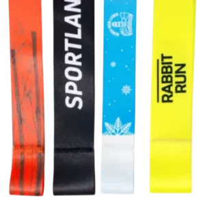 A selection of custom medal ribbons with various designs, including winter, running, and branding themes.